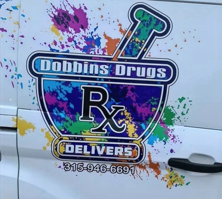 Dobbins Drugs prescription-delivery vehicle with its colorful pharmacy logo.